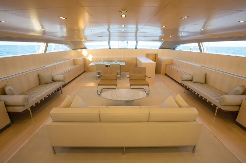 Unfurled's main saloon, interior by Oliver Stirling of Stirling & Co working inside Frers's exterior and hull lines. Stirling has said the owners had 'an uncompromising conviction in the power and utility of modern design.'