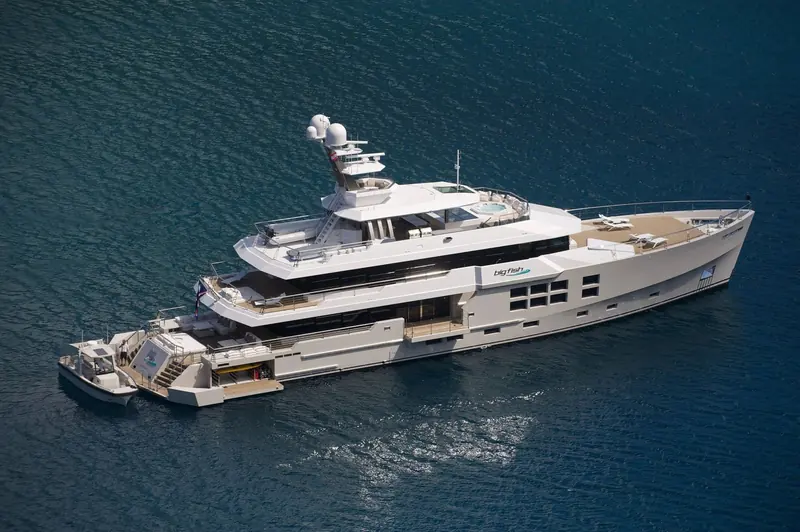 Big Fish from above, tender alongside the fold-down aft beach club that let Beattie's family reach the water without lowering a full tender ramp.