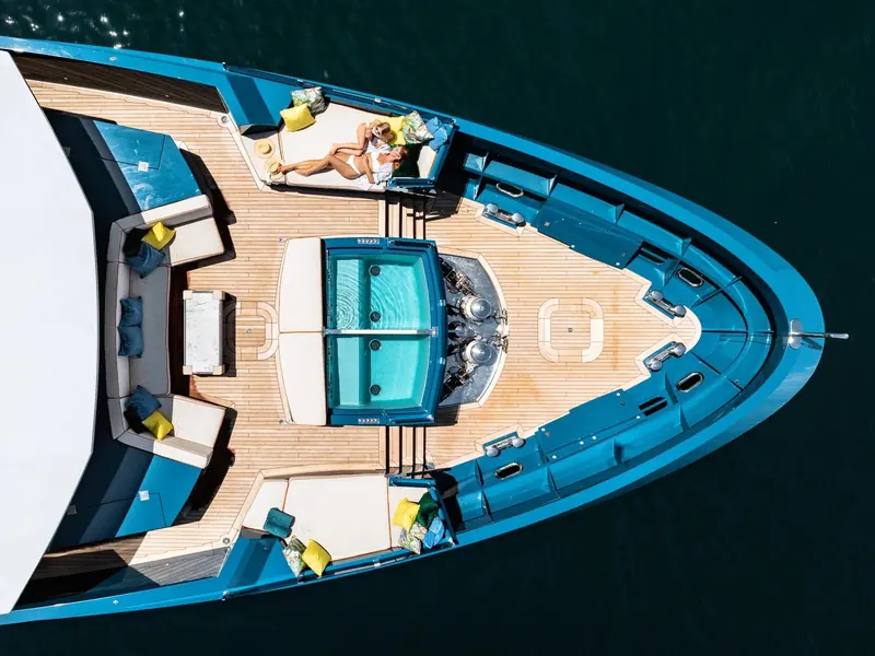 King Benji's foredeck pool and lounge, built around Golder's brief for real outdoor space rather than a conventional formal sundeck.