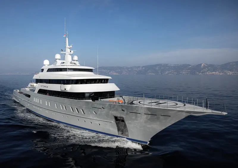 Victorious, the 85 metre AKYACHT delivered in 2021, running off Monaco with her helideck folded down over the stern.
