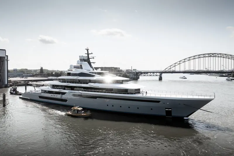 Leviathan, Oceanco's 111 metre motor yacht, departs the yard's Alblasserdam basin past the Spoorbrug rail bridge; naval architecture is by Lateral Naval Architects.
