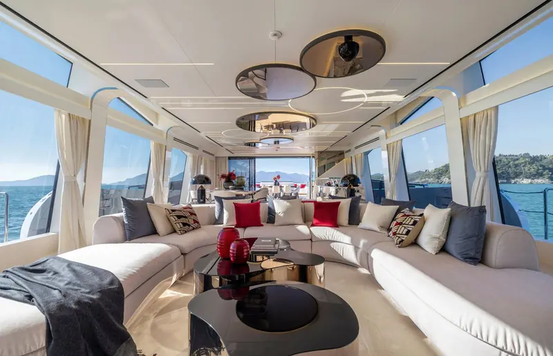 The main saloon aboard N1, Lobanov's exterior language carried through into the joinery.