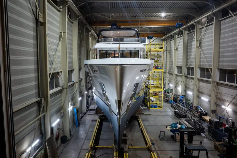 MY Ursus's bow inside the Balk Shipyard shed ahead of her January 2025 relaunch, the reflective hull showing the new forward section Mulder Design drew onto the original 24-metre Acico hull.