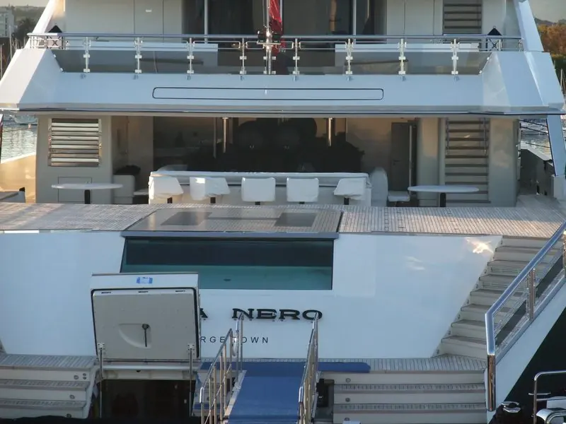 Deck stairs frame the plunge pool set into the aft deck of Alfa Nero at Antibes.