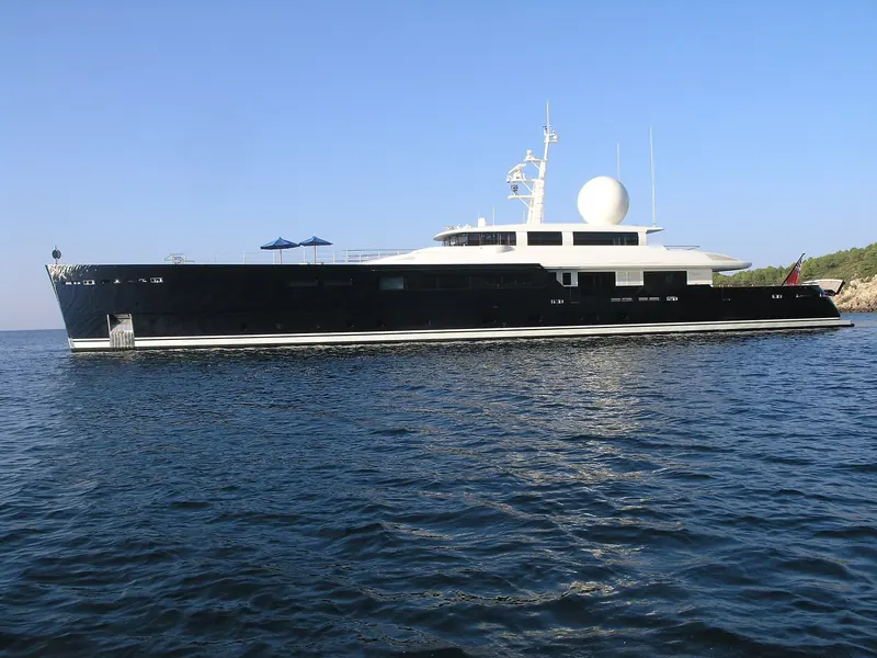 Galileo G at anchor in the gulf of Alghero. The 55 metre Picchiotti is one of the Vitruvius hulls drawn by Philippe Briand, and the long low profile is the studio signature.