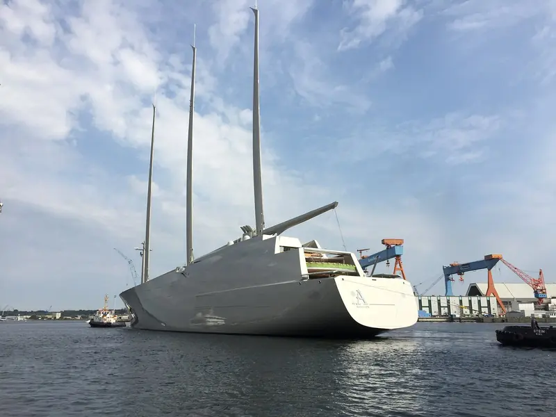 Sailing Yacht A under tow by harbour tugs at the German Naval Yards shipyard in Kiel in September 2016, during sea trials ahead of her February 2017 delivery.