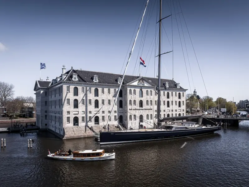 Nilaya passing Amsterdam's Het Scheepvaartmuseum on her way to open water; Reichel/Pugh designed the naval architecture and hull engineering, Nauta Design the exterior and interior.