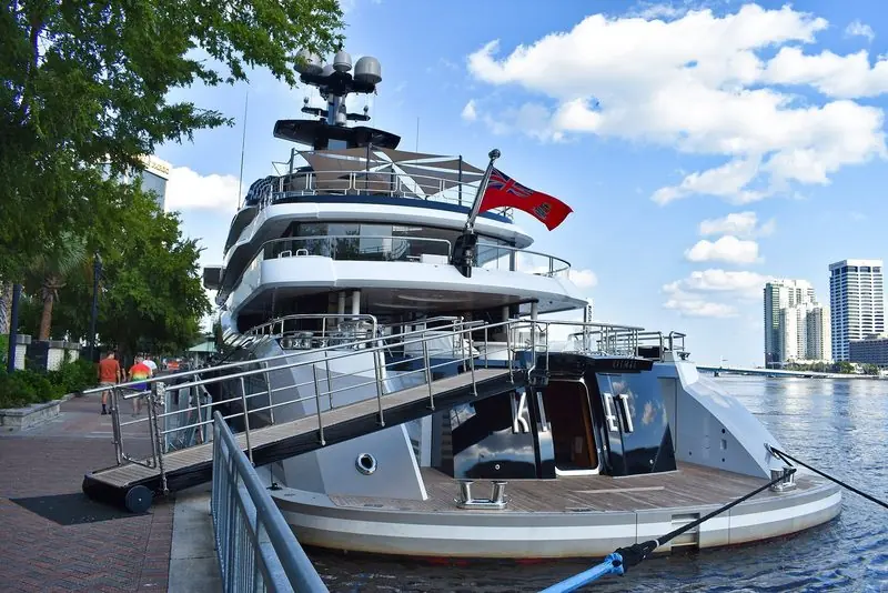 Kismet lies stern to the riverside promenade at Jacksonville, Florida, with a passerelle down to the quay.