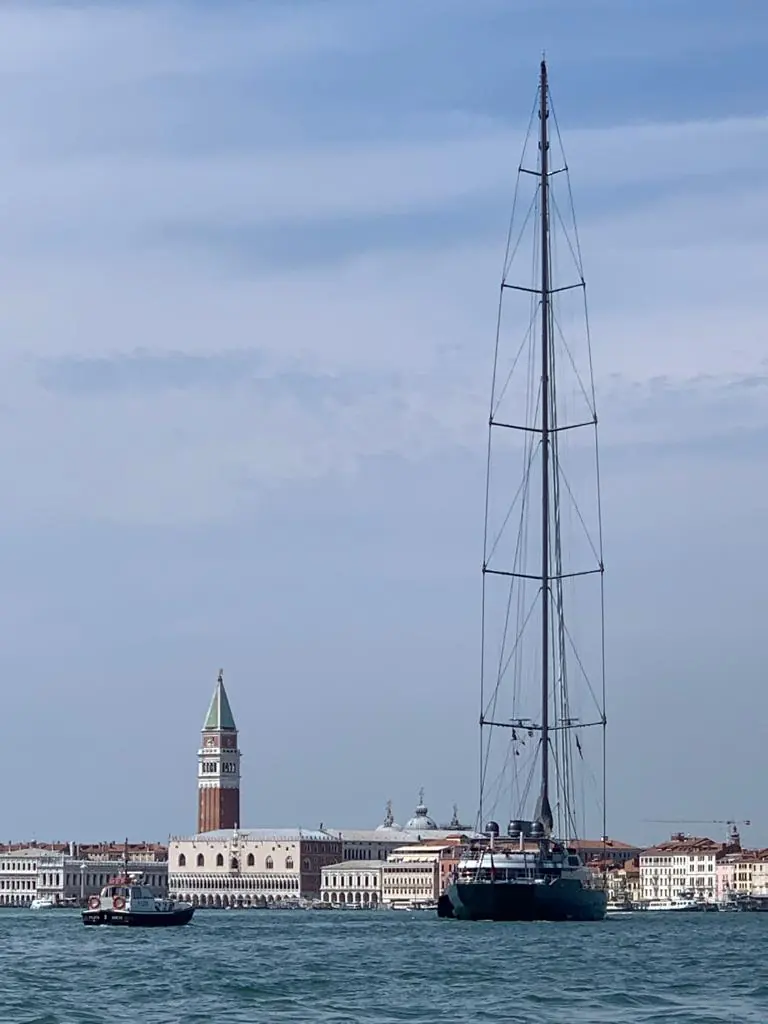 M5 passing the Campanile and Doge's Palace in Venice in August 2020, the same rig that carries the world's largest working genoa outside a spinnaker.