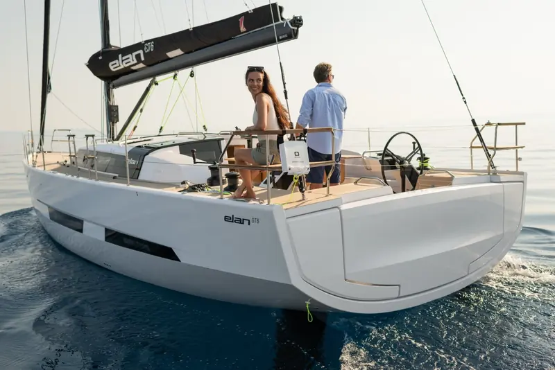 Elan GT6, naval architecture by Humphreys Yacht Design and styling by Studio F.A. Porsche, under sail with her crew working the stern.