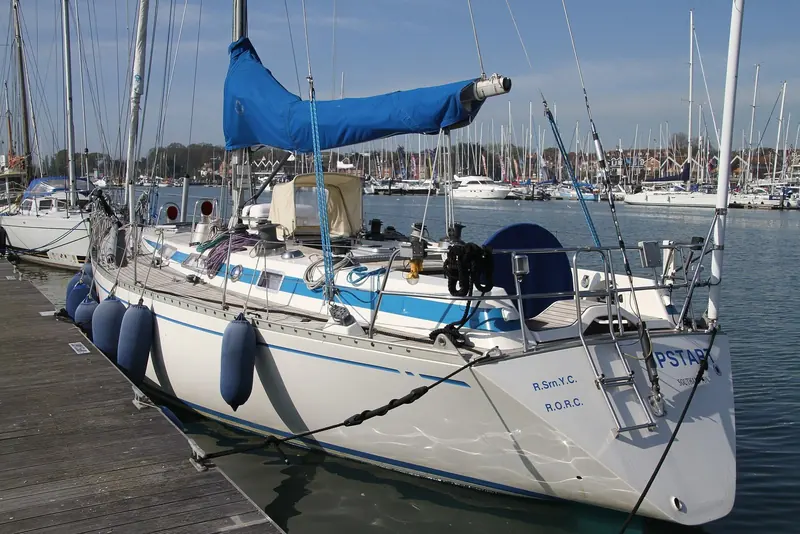 A Swan 42, the 13 metre one-design Ron Holland penned for Nautor's Swan in 1980, moored in the Solent. Thirty-eight were built through 1985, part of the run of Swan yachts that built Holland's reputation before the superyacht era.