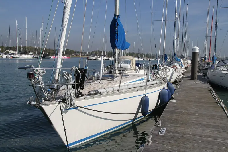 The same Swan 42, bow-on, showing the raked stem and low freeboard typical of Holland's early 1980s IOR-influenced production designs for Nautor.