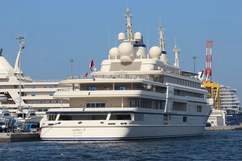 Al Said shows her name and home port across the transom at a quay in Oman.