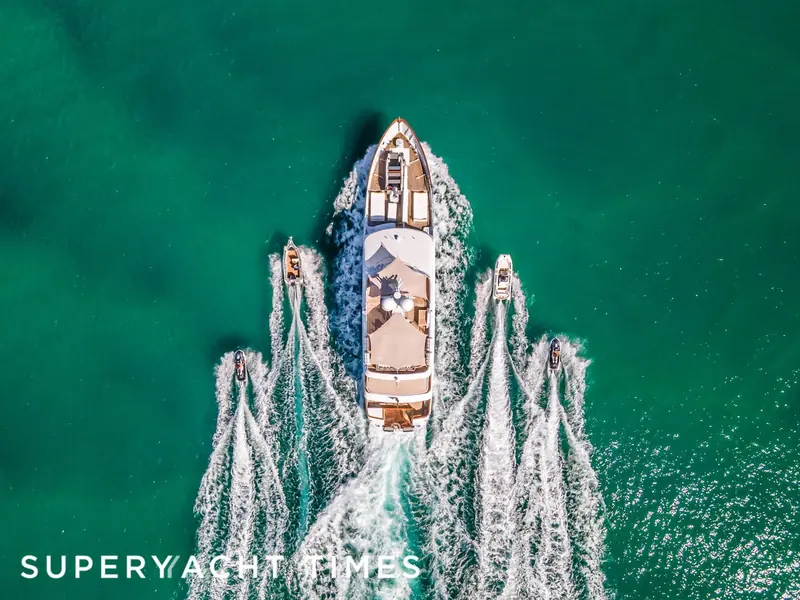 Seen from directly above, Marama cuts twin white wakes through turquoise water.