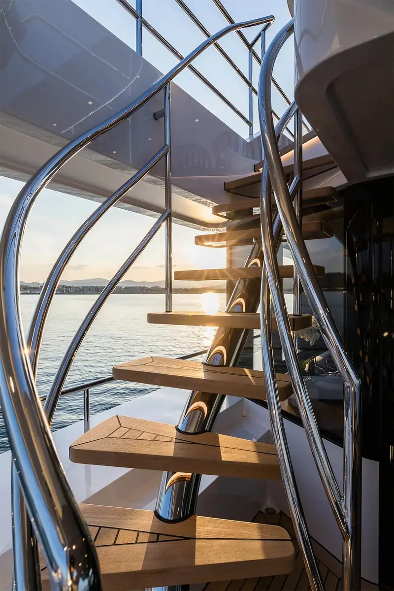 Brigadoon's spiral staircase at sunset, the kind of architectural detail Studio Indigo's founder Mike Fisher brought from his earlier career designing houses and galleries.