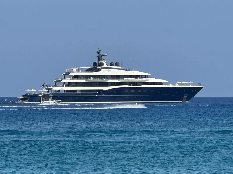 Here Comes The Sun sits at anchor in deep blue water off Protaras in Cyprus.