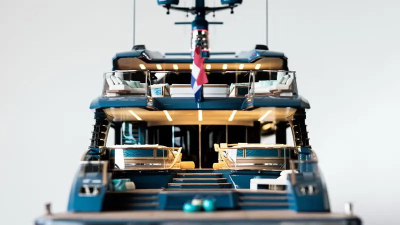 PHI's upper aft deck under way, the Dutch flag at the stern; Royal Huisman is a sailing-yacht builder that took on the yard's first Van Oossanen-designed motoryacht hull specifically to solve the tonnage problem.
