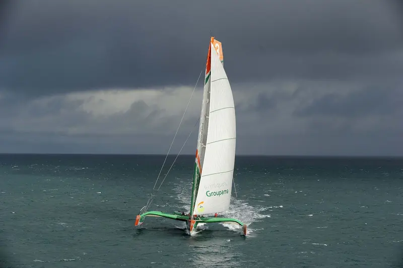 Groupama 3 foiling under spinnaker during the 2010 Jules Verne Trophy campaign that set a new round-the-world record of 48 days.