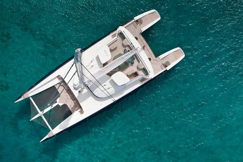 Hemisphere, the 44.2m Pendennis catamaran with naval architecture and exterior by VPLP, seen from directly above at anchor; her split forward cockpits are a hallmark of VPLP's large-catamaran layout.