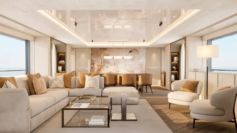 A Vripack lounge finished in book-matched marble, sofas and armchairs arranged around a low table under a coved, lit ceiling.