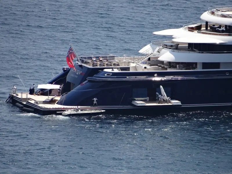 A tender waits alongside the open beach club at the stern of Al Mirqab.