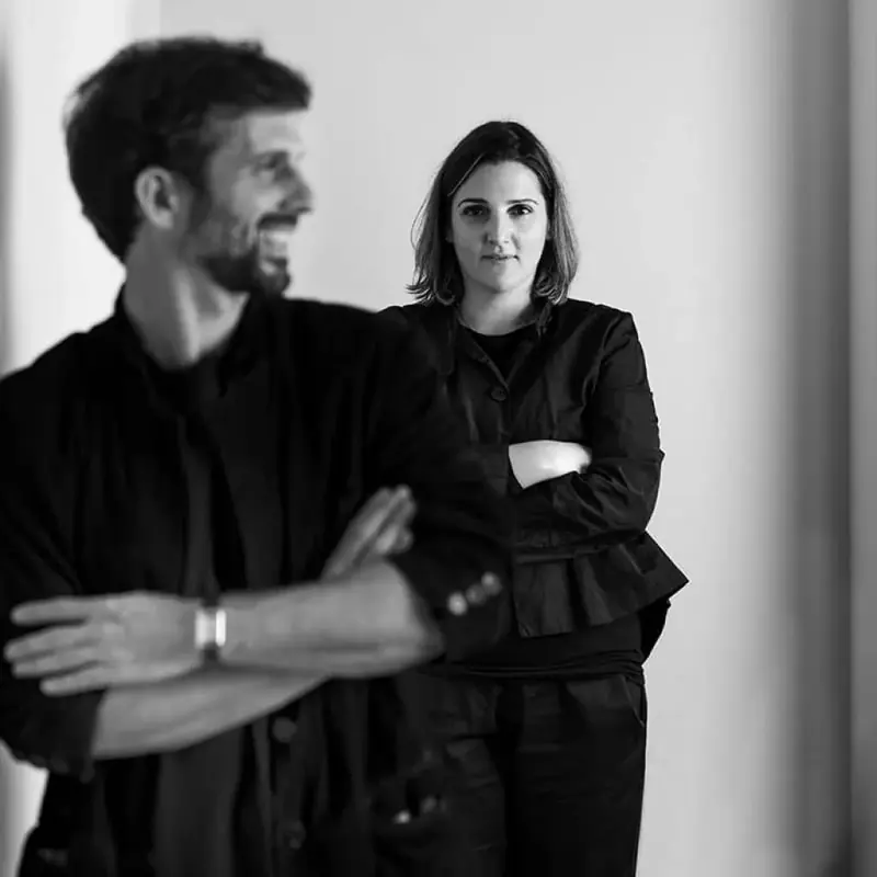 Bernardo and Marcella Zuccon, the studio's principals, photographed together in black and white.