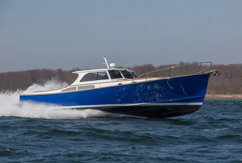 A New England Boatworks 50, the flybridge cruiser end of Zurn's Downeast range, built for New England conditions rather than open-ocean passages.