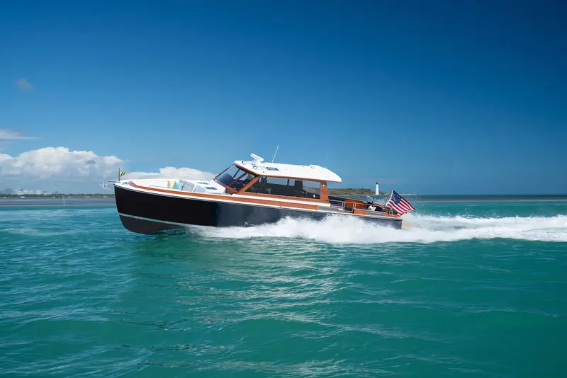A B&G Daychaser 48 running off Miami, one of the flybridge day-boat designs that sit between Zurn's small runabouts and its long-range expedition cat.