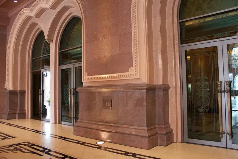 One of the arcaded entrances at Emirates Palace, the hotel whose name the marina at its feet has borrowed.
