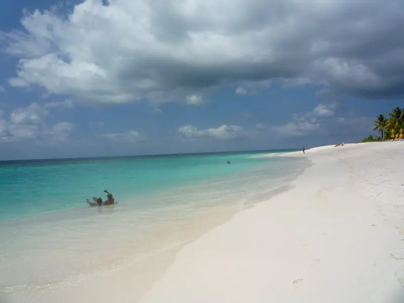 Shoal Bay's reef-sheltered sand and turquoise shallows, routinely ranked among the best beaches in the Caribbean.