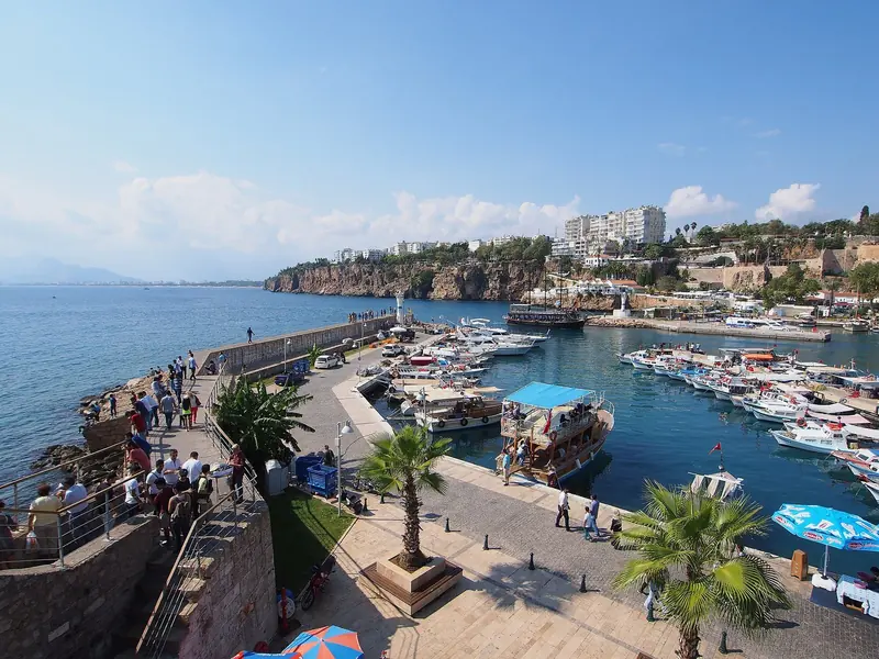 The harbour promenade in Antalya, with the old town rising behind the waterfront.