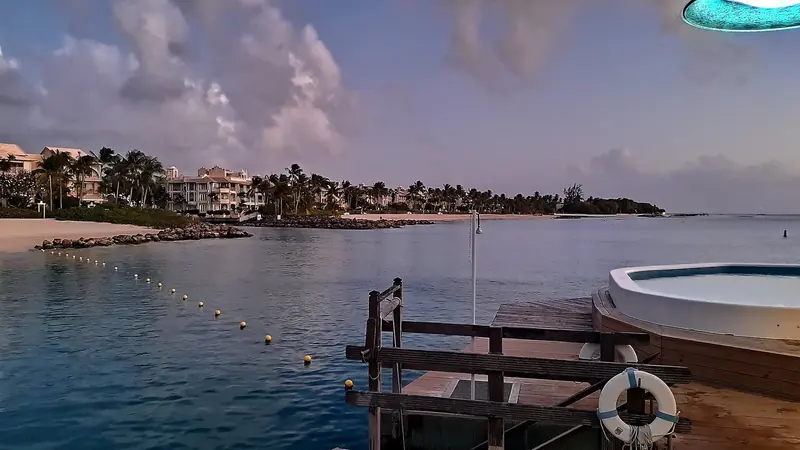The marked swimming and mooring channel inside Port St Charles, with the lagoon's residences behind.