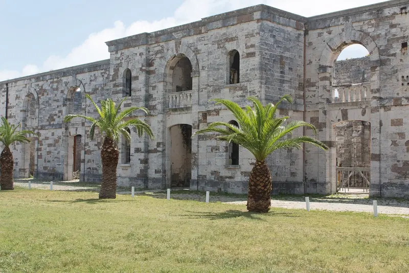 The roofless stone shell of the Victualling Yard at the Royal Naval Dockyard, part of the former Royal Navy base built on Ireland Island through the 19th century.