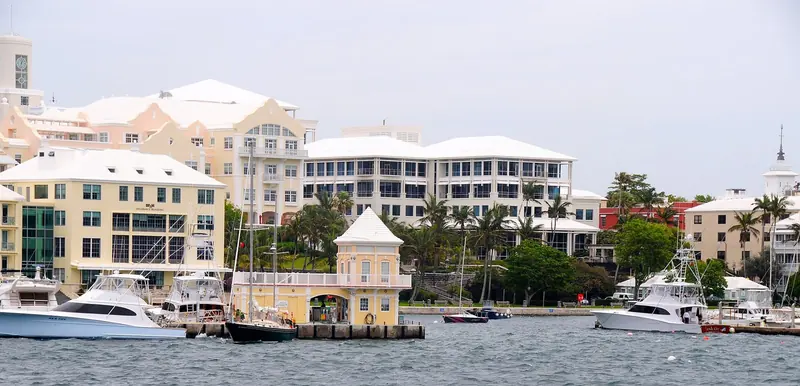 Hamilton's waterfront skyline above sportfishing boats moored along Front Street, in the harbour that anchors the island's capital.