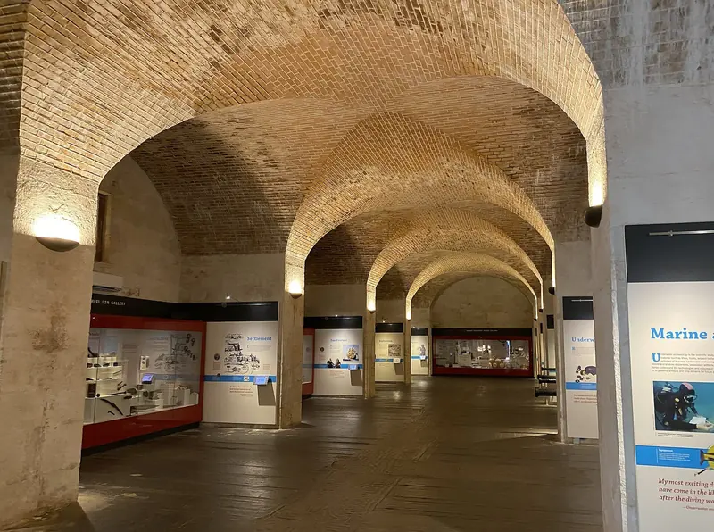 The vaulted brick galleries inside the National Museum of Bermuda, built within the Keep's former storehouses at the Royal Naval Dockyard.