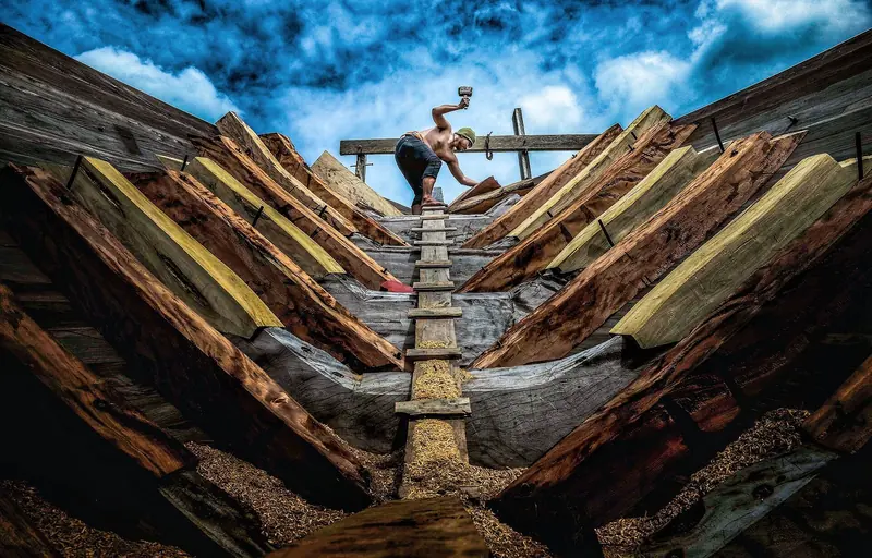 A phinisi hull under construction by hand in Bulukumba, South Sulawesi - the traditional home of Bugis shipbuilding where Celestia was built.