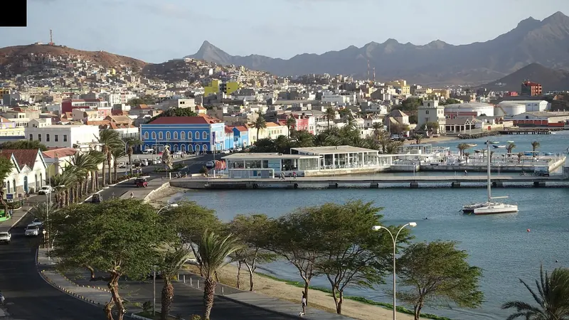 Mindelo's waterfront promenade, with the town's colonial-era buildings and Monte Verde rising behind the bay.