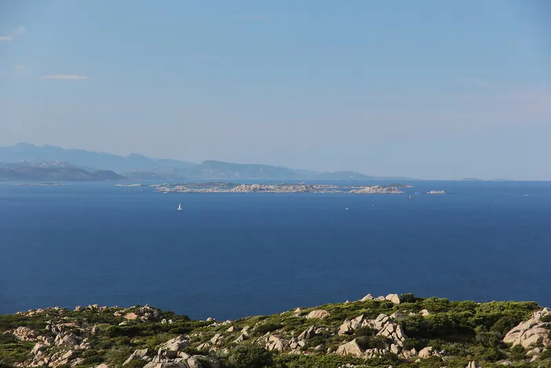 Low granite and scrub on the Lavezzi islands in the Strait of Bonifacio, where four seabird zones are now closed and anchoring is sand only.