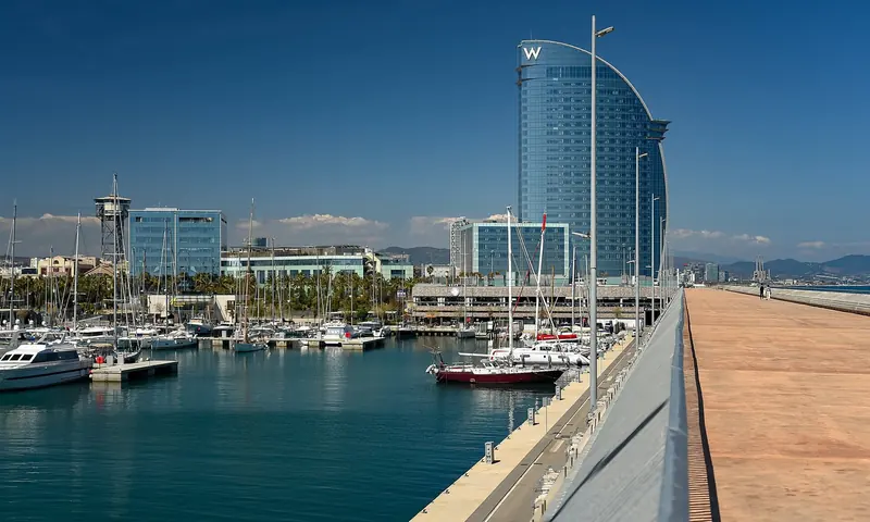 The Barcelona waterfront with the marina at the foot of the city, fifteen minutes from an airport that connects to essentially everywhere.