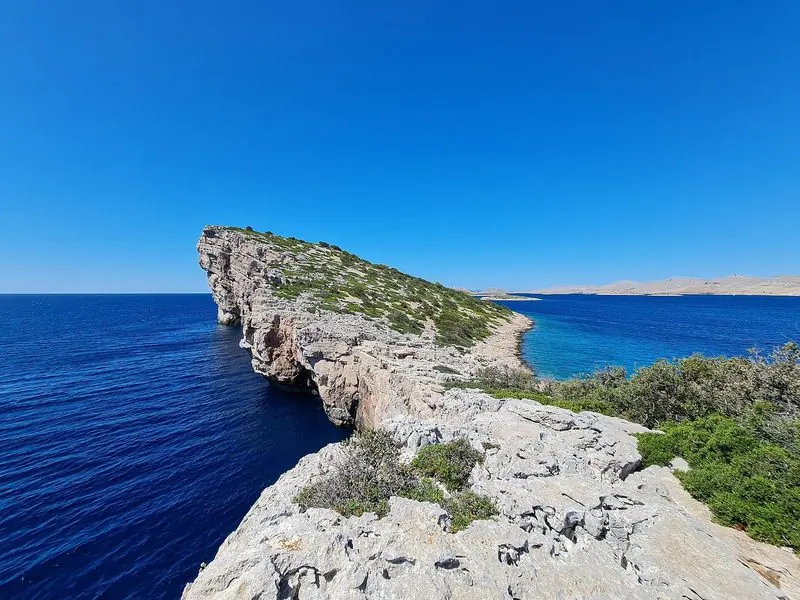 The seaward side of the Kornati chain, bare rock straight into deep water.