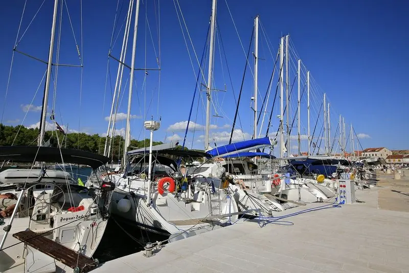 Pontoon berths in a Croatian marina, sized for sailing yachts rather than 50 metres.
