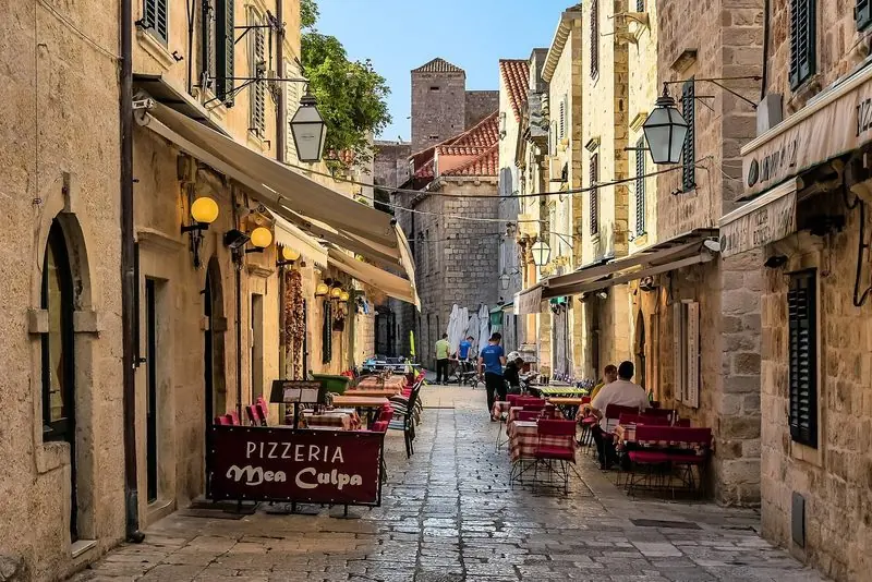 A stone street of restaurants in the old town, minutes from the water.