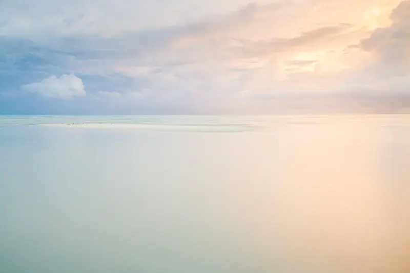 Dawn breaks over the sandbar off Cayo Coco, one of the northern cays served by Cuba's newer marina developments.