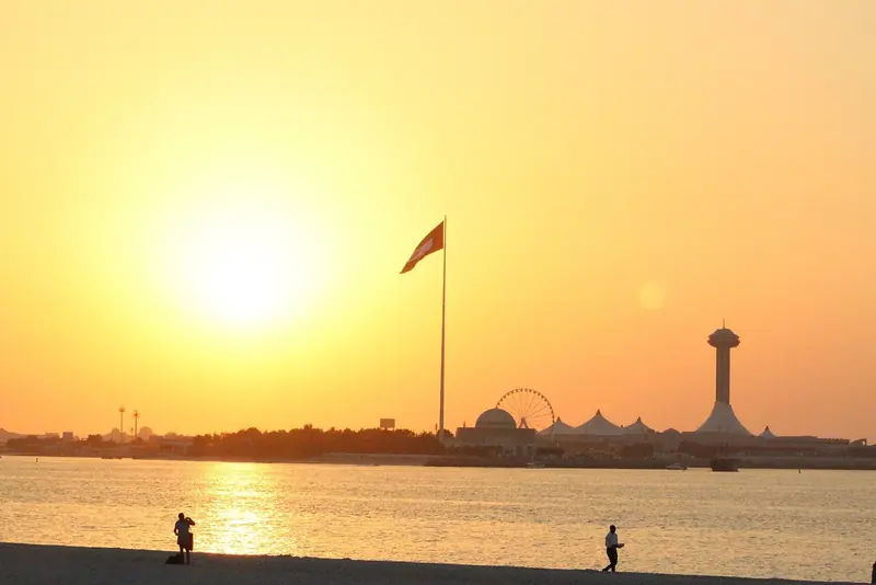 Sunset over the Abu Dhabi corniche, 75 nautical miles down the coast and now reachable on a single inter emirate permit.