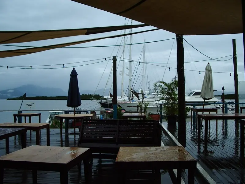 The marina deck at Denarau, charter catamarans and a sailing yacht moored behind