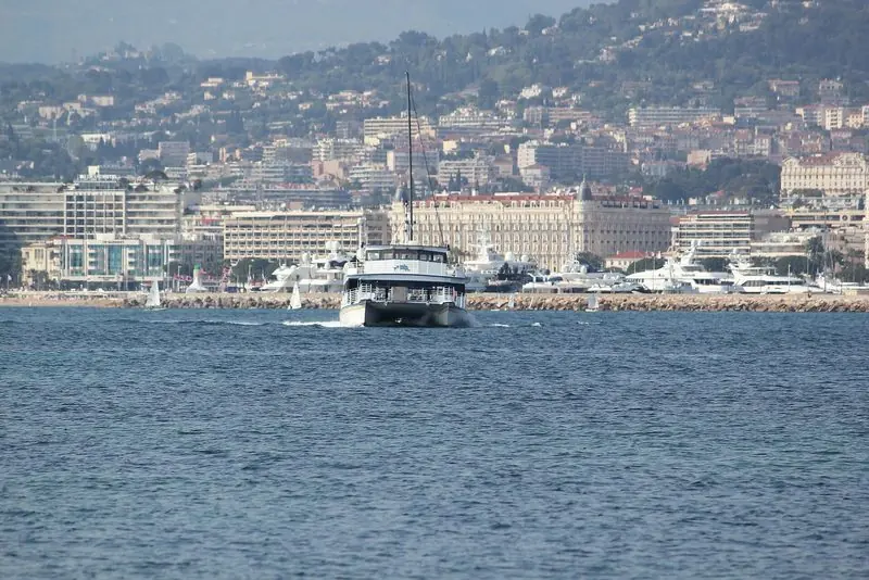 The Cannes waterfront seen from the water, the Croisette hotels facing the bay.