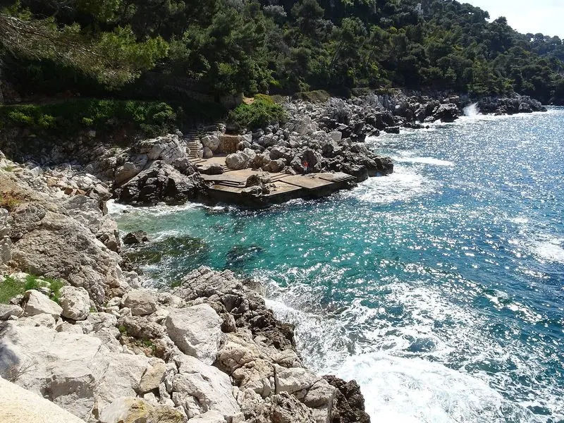 The rocky shore of Cap Ferrat, walkable from the anchorages on the eastern side.