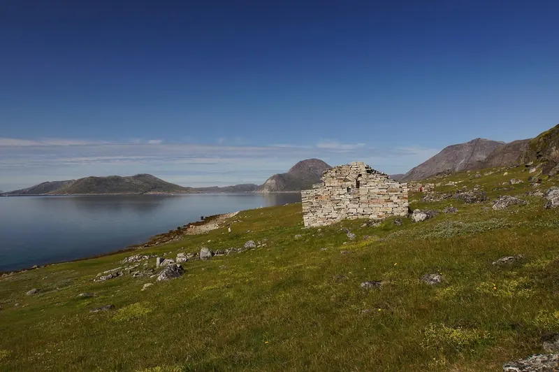 The ruined stone walls of Hvalsey Church, Greenland's best-preserved Norse ruin, stand above a South Greenland fjord near Qaqortoq.