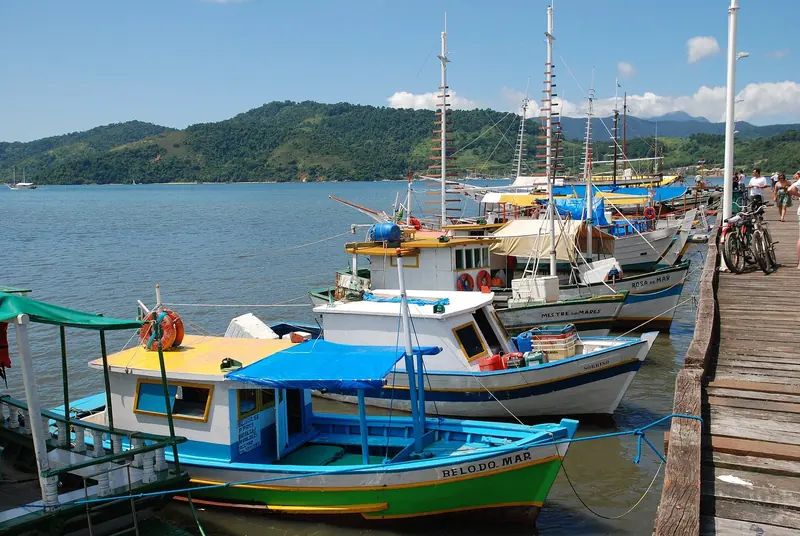 Fishing boats in Paraty harbour at sunset, working alongside the schooners that take visitors out to the islands.