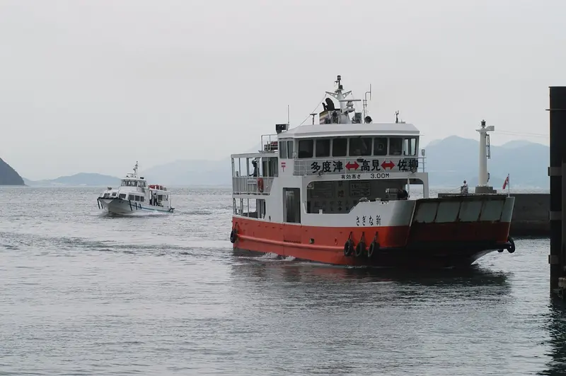 A local car ferry serving one of the Inland Sea's small-island routes, the transport network a cruising boat shares the water with.